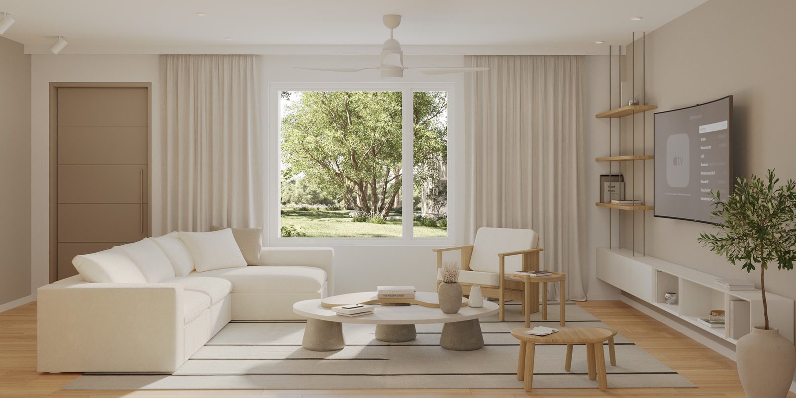 Living room with a cream sectional, oak accents and linen drapery